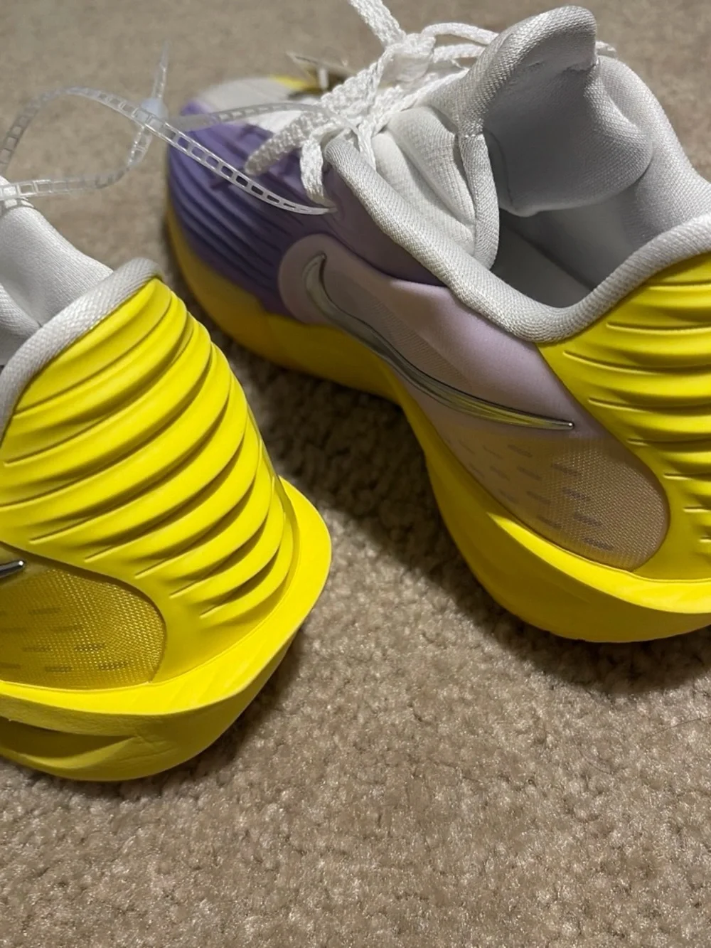 Nike Kids White Sneakers with Yellow and Lavender Accents